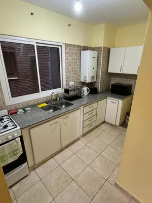 a kitchen with a sink and a counter top at Bv San Juan - Nueva Cordoba 2 in Cordoba