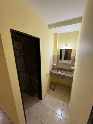 a bathroom with a sink and a toilet and a mirror at Bv San Juan - Nueva Cordoba 2 in Cordoba