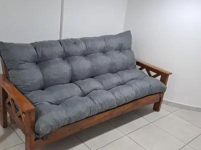 a gray couch sitting in a room at Salguero Loft in Cordoba