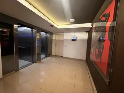 a hallway of an office with doors and a painting at Salguero Loft in Cordoba