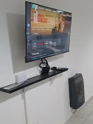 a flat screen tv hanging on a wall at Salguero Loft in Cordoba