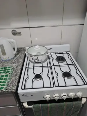 a pot sitting on top of a stove in a kitchen at Salguero Loft in Cordoba
