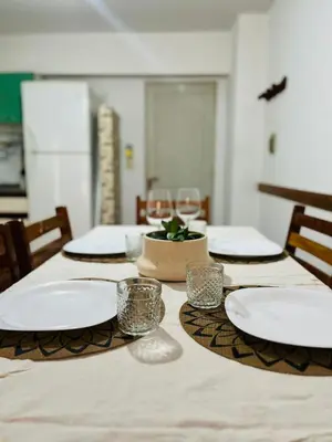 a table with plates and glasses on top of it at poeta lugones - nva cba in Cordoba