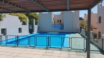 a large swimming pool in a building at Castillo Del Lago - Carlos Paz - D18 in Villa Carlos Paz