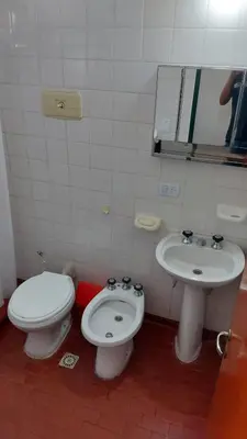 a bathroom with a toilet and a sink at Castillo Del Lago - Carlos Paz - D18 in Villa Carlos Paz