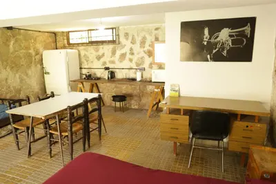 a kitchen and dining room with a table and chairs at Apartamento por día Cuesta Blanca in Cuesta Blanca