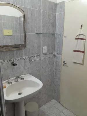 a bathroom with a sink and a mirror at Casa ideal Pileta, Quincho y Patio Enorme in Bialet Massé