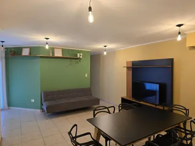 a living room with a couch and a table and chairs at ByB ALQUILERES 3 in Cordoba