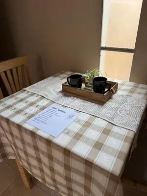 a table with two pots on top of a table at Apart Suipacha in Río Cuarto
