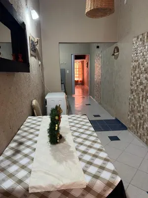 a room with a table with a christmas tree on it at Apart Suipacha in Río Cuarto