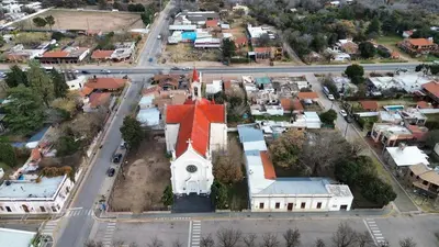 an aerial view of a small town with a church at Departamento en Nono Descanso y aventura in Nono