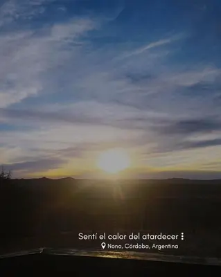 a sunset with the sun in the sky at Acogedora cabaña en el corazón de Nono in Nono
