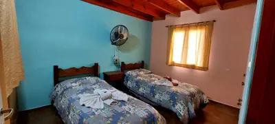 a bedroom with two beds with towels on them at Sierra madre 2 in El Rincón