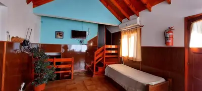 a small room with a bed and a tv and a window at Sierra madre 2 in El Rincón