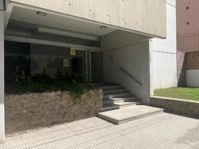a building with a staircase in front of a building at Amplio departamento en Cofico in Cordoba
