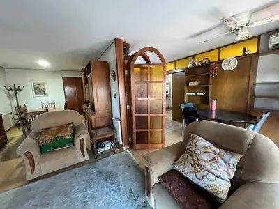 a living room with two couches and a table at Amplio departamento en Cofico in Cordoba
