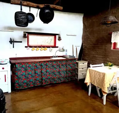 a kitchen with a table and a sink and a table and a table at Rancho Eco Loft in San Javier
