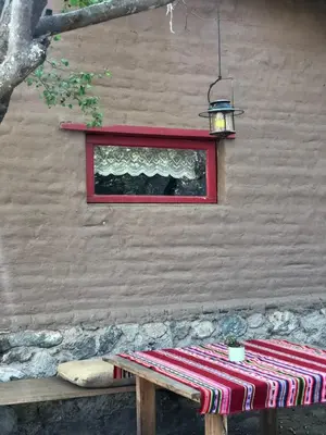 a picnic table with a red window and a red window at Rancho Eco Loft in San Javier
