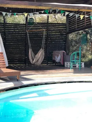a patio with a hammock and a pool at Rancho Eco Loft in San Javier