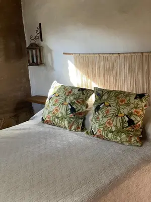 a bedroom with a bed with two pillows on it at Rancho Eco Loft in San Javier