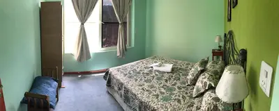 a bedroom with a bed and a window at Fragancias Serranas in Cortaderas