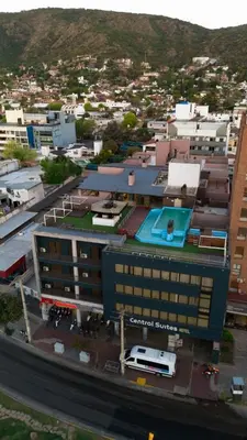 an aerial view of a city with a large building at Central Suites Hotel in Villa Carlos Paz
