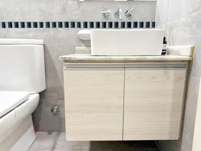 a bathroom with a sink and a toilet at OPERA Apartamentos in Villa Carlos Paz