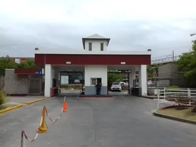 a gas station with a car parked in it at Departamento Temporario Villa Sol in Cordoba