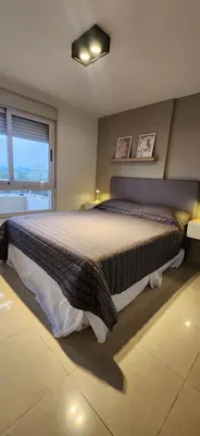 a bedroom with a large bed and a window at MILANO 2d2b - RF - Gral Paz - Hogares de Calidad in Cordoba
