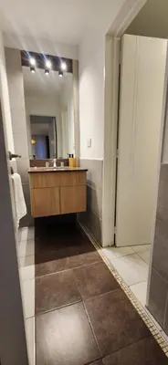 a bathroom with a sink and a large mirror at MILANO 2d2b - RF - Gral Paz - Hogares de Calidad in Cordoba