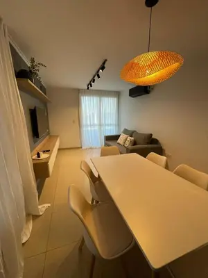 a living room with a table and a couch at MILANO 2d2b - RF - Gral Paz - Hogares de Calidad in Cordoba