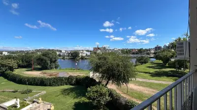 a view of a river from a balcony at Edificio ALEM CENTRO in Villa Carlos Paz
