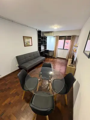 a living room with a couch and chairs at Apartamento en Pleno Nueva Córdoba, Garzon, By ApartCba in Cordoba