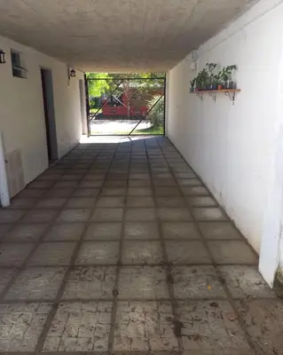 an empty room with a door to a yard at Casas Mya in Santa Rosa de Calamuchita