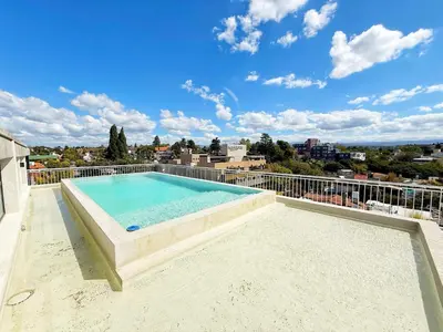 a swimming pool on the roof of a building at Edificio Catalina in Villa Carlos Paz