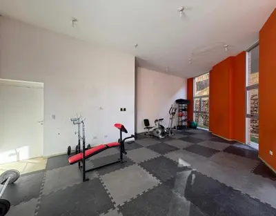 a room with a gym with a treadmill at Torres H Güemes in Cordoba