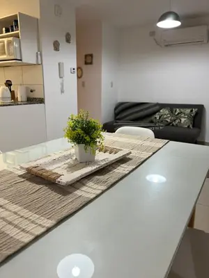 a kitchen with a table with a potted plant on it at Torres H Güemes in Cordoba