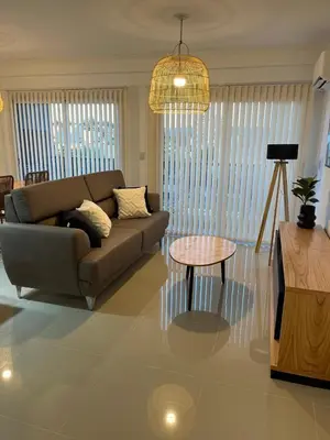 a living room with a couch and a table at Departamento Venetto 8 in Villa Carlos Paz