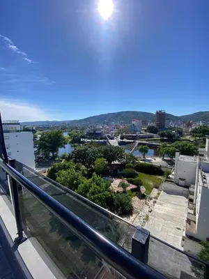 a view of a city from a balcony at Departamento Venetto 8 in Villa Carlos Paz