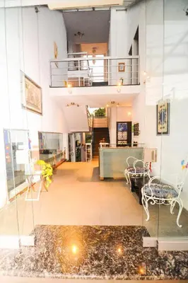 a room with a table and a chair in a building at Del Vaiven in Villa Carlos Paz