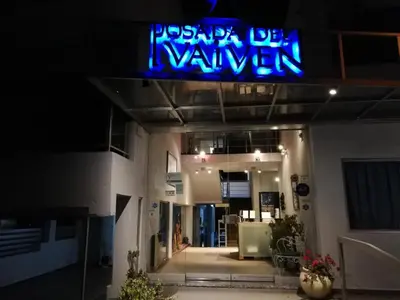 a neon sign on the front of a building at Del Vaiven in Villa Carlos Paz