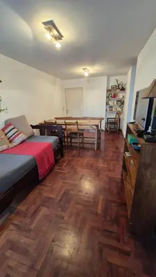 a room with a bed and a dining room with a table at Espacio C Obispo Salguero in Cordoba