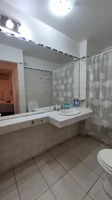 a bathroom with a sink and a toilet at Espacio C Obispo Salguero in Cordoba