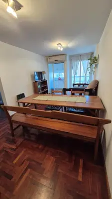 a large wooden table in a living room at Espacio C Obispo Salguero in Cordoba