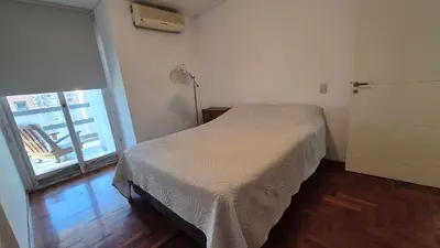 a small bedroom with a bed and a window at Espacio C Obispo Salguero in Cordoba