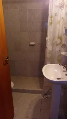 a bathroom with a shower and a sink at Complejo Steffen in Merlo