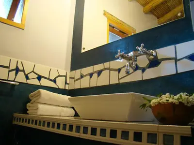 a bathroom with a sink and a mirror at Posada La Valentina in Villa de Las Rosas
