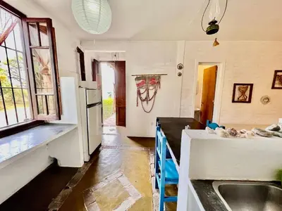 a kitchen with a sink and a refrigerator at La Confianza in Las Chacras (La Paz)