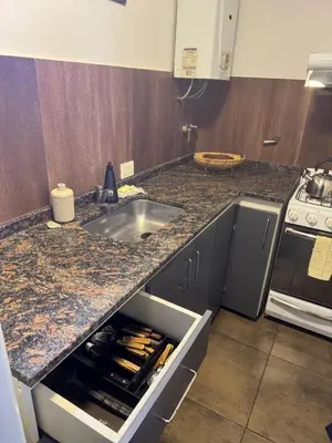 a kitchen with a sink and a counter top at Carlos Paz Roque Sainz Peña in Villa Carlos Paz