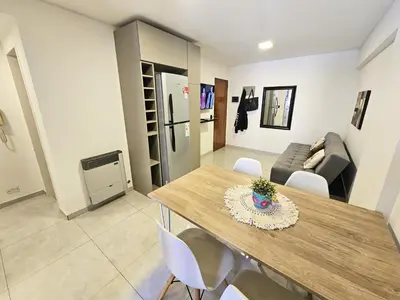 a living room with a table and chairs and a couch at Chic in Cordoba